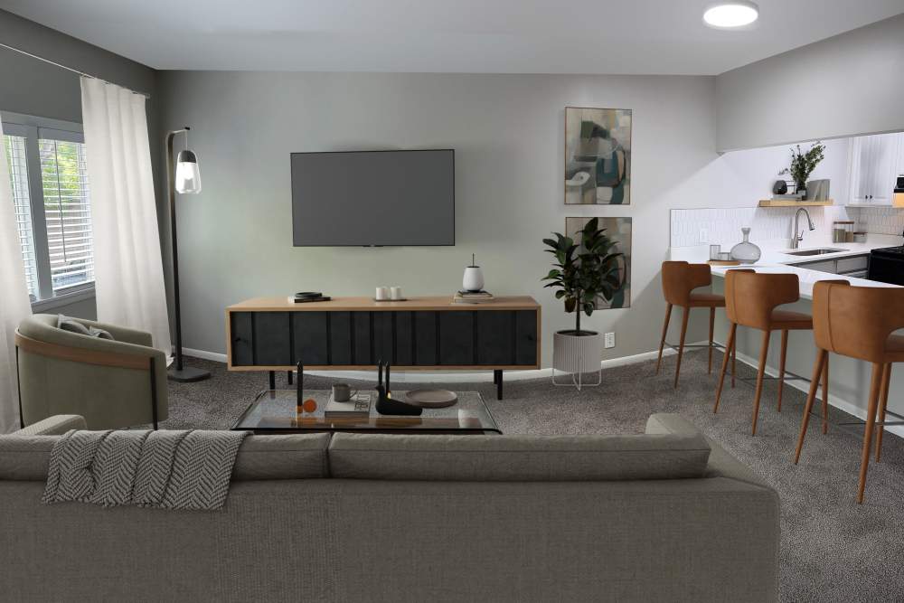 Living room with plush carpeting at Belmont Place Apartments in Nashville, Tennessee