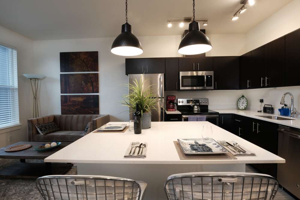 Dining room with close access to fully-equipped kitchen with oven and stove at 27 Elm in Redmond, Oregon, 