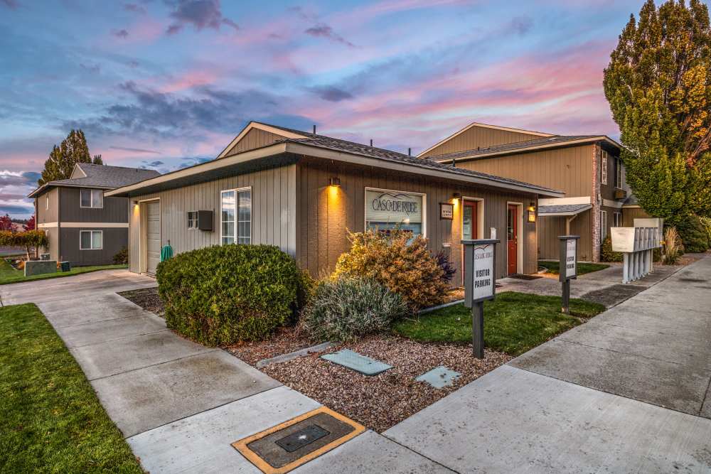 Leasing office exterior at dusk at Cascade Ridge in Madras, Oregon