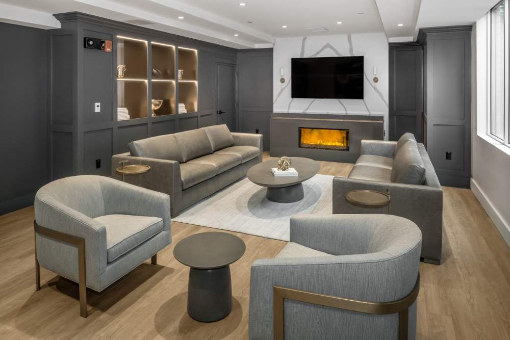 Seating area and fireplace in the clubhouse at Parkside Place in Cambridge, Massachusetts
