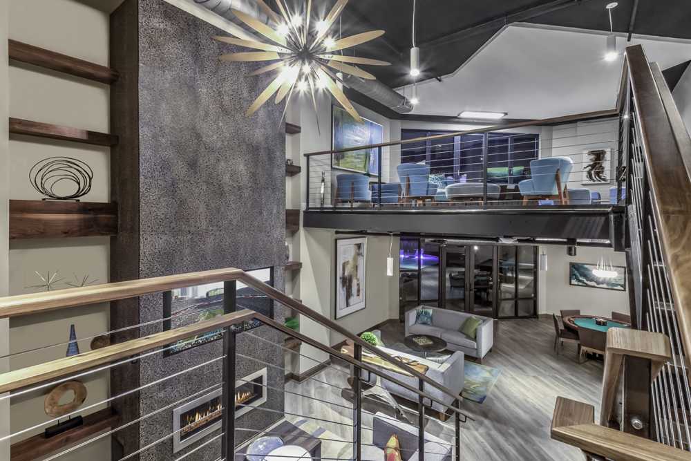 View of the clubhouse with multiple floors and seating at Greenside in Charlotte, North Carolina