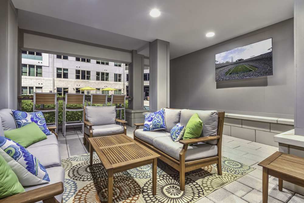 Community office room with a TV and chairs at Greenside in Charlotte, North Carolina