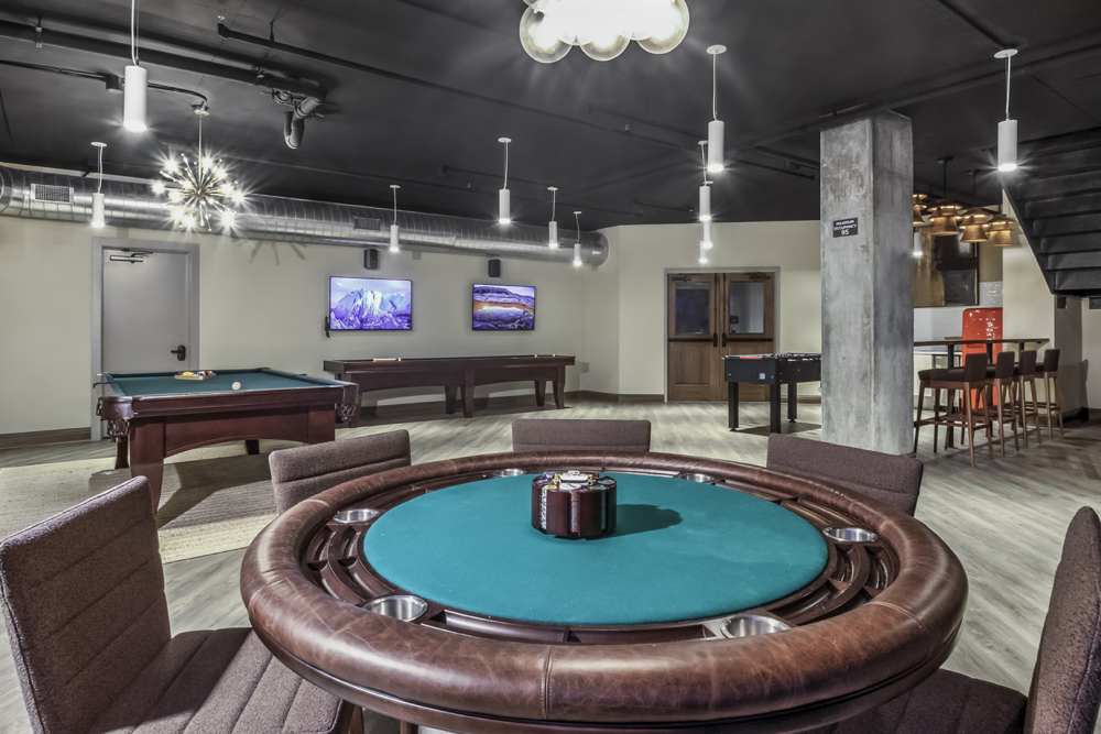 Community game room with billiards and shuffle board at Greenside in Charlotte, North Carolina