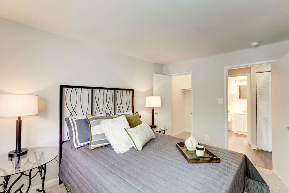 model bedroom with a grey bed at The Landings II in Fort Belvoir, Virginia