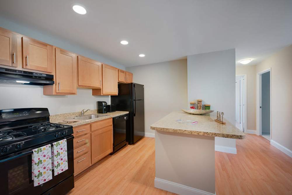 wood-style flooring in a kitchen model at The Landings II in Fort Belvoir, Virginia