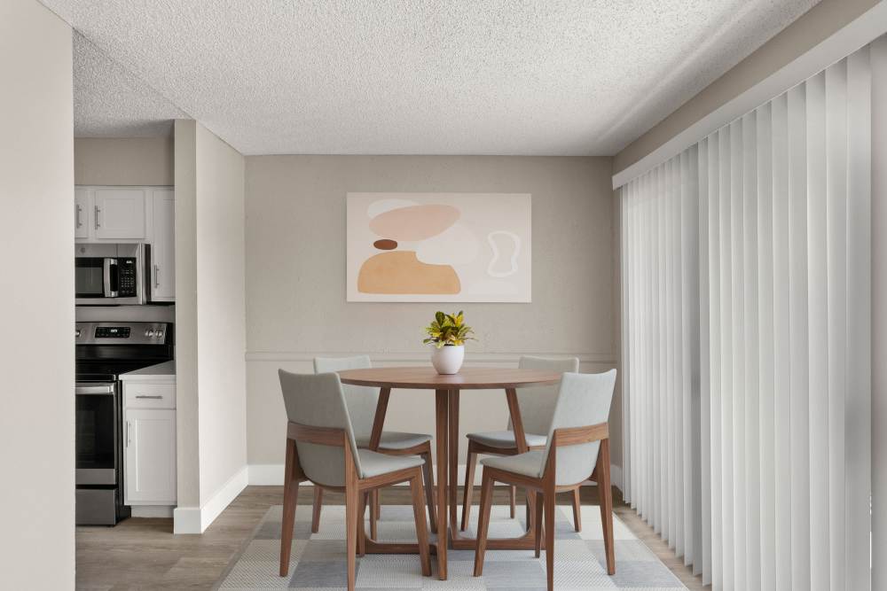 Dining area with round table chairs at Cielo on Gilbert in Mesa, Arizona