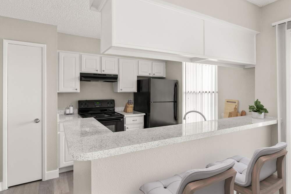 Kitchen with wood-style flooring at Cielo on Gilbert in Mesa, Arizona