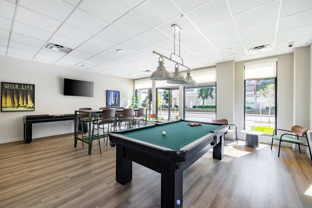 Photo of community game room with shuffle board and billiards at Traditions at Hazelwood in Portland, Oregon