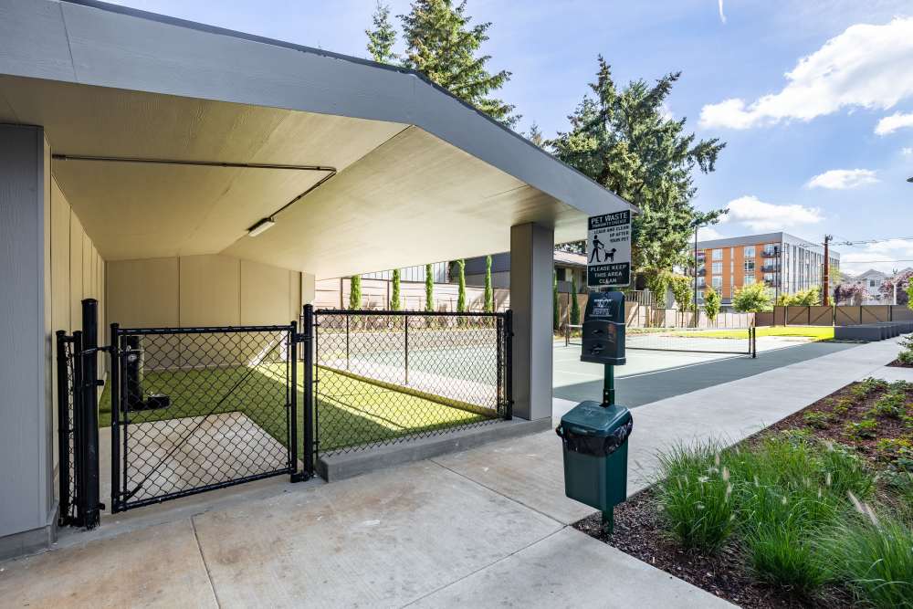 Fenced Dog Area with turf and drinking fountain at Traditions at Hazelwood in Portland, Oregon