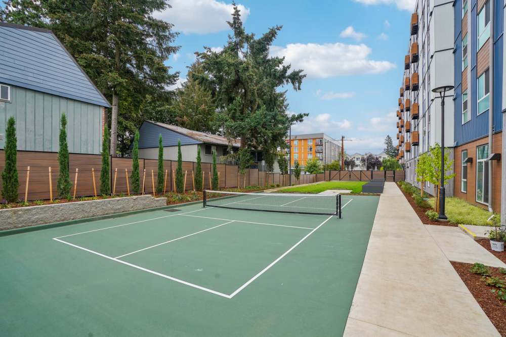 The community outdoor pickle ball court and lawn at Traditions at Hazelwood in Portland, Oregon