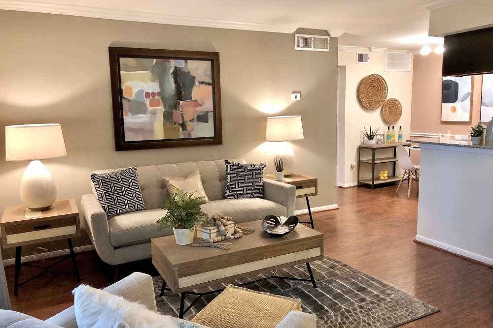 Living room with sofa and side lamps  at The Abbey At Enclave in Houston, Texas