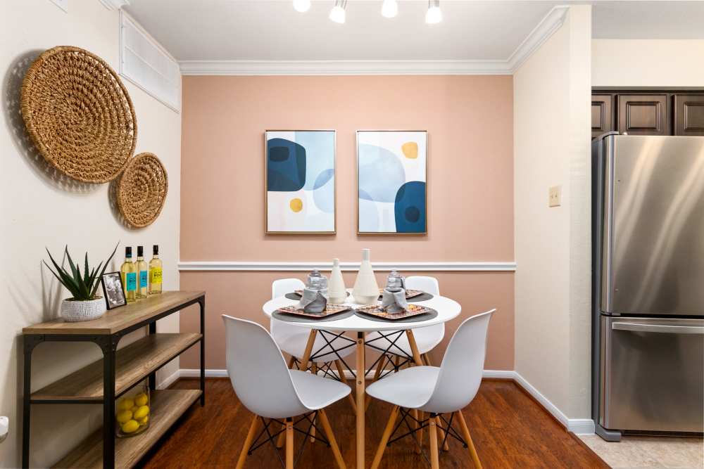 Dinning area with hard wood flooring  at The Abbey At Enclave in Houston, Texas