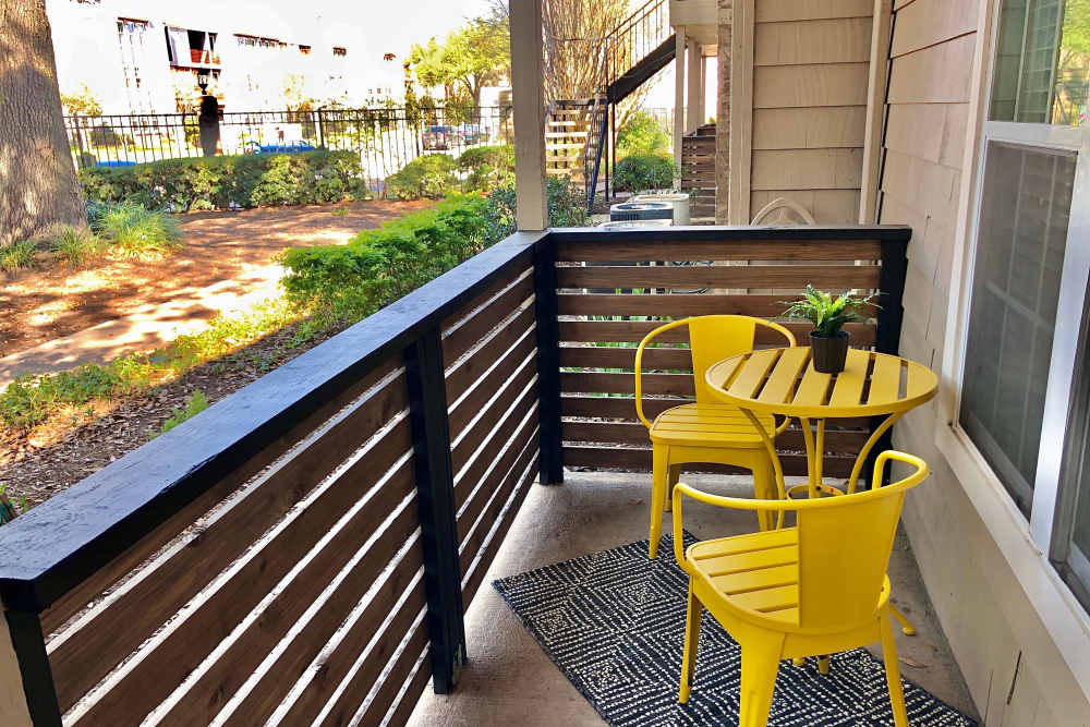 Patio with wooden railing  at The Abbey At Enclave in Houston, Texas
