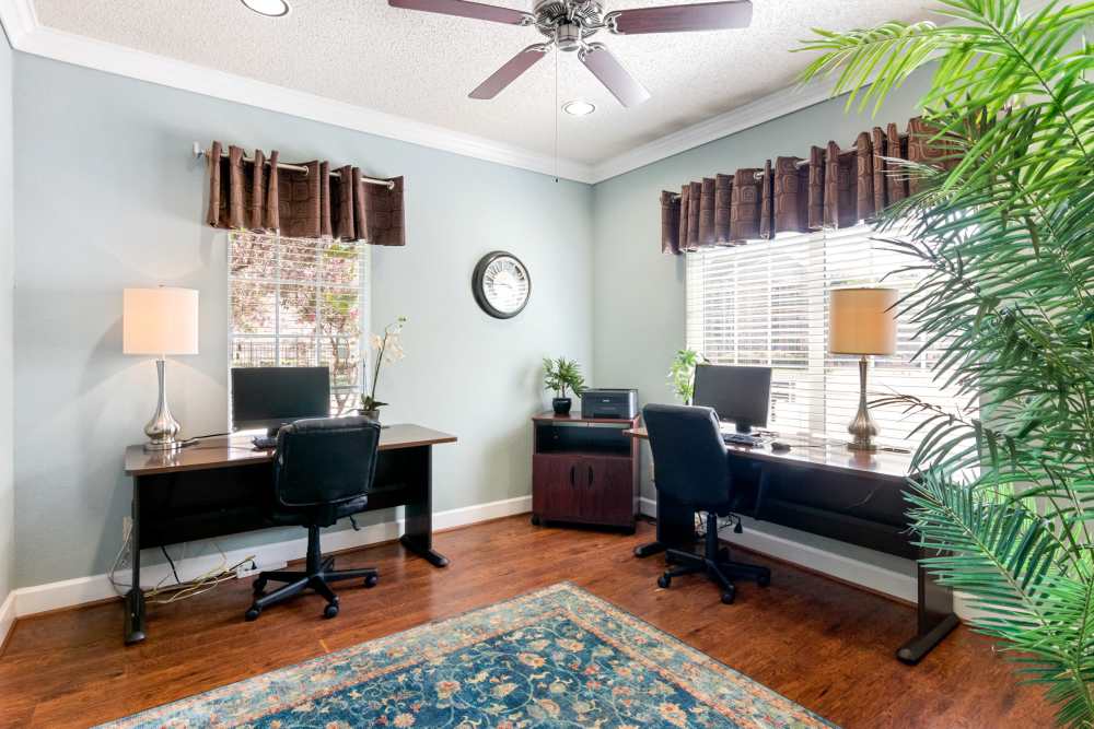 Study room with two tables  at The Abbey At Enclave in Houston, Texas