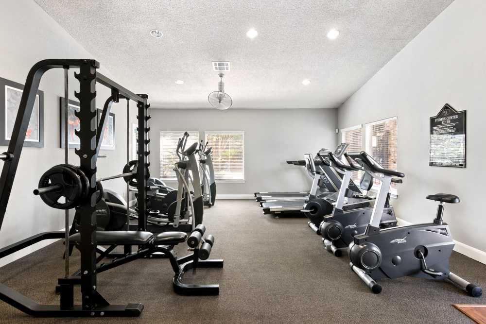 Fitness center with tread mills at The Abbey At Enclave in Houston, Texas