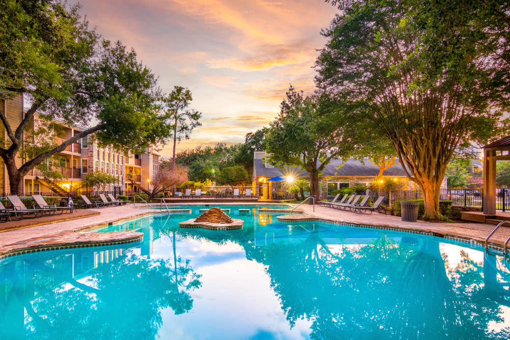 Pool with lounge chair  at The Abbey At Enclave in Houston, Texas