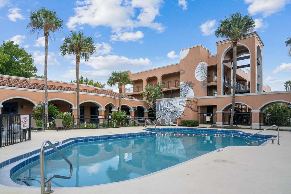 Pool side view of the building at Vivo Living Kissimmee in Kissimmee, Florida