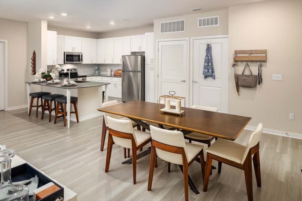 Well-lit and spacious bedroom with carpet at Shadetree Apartments in Ruskin, Florida