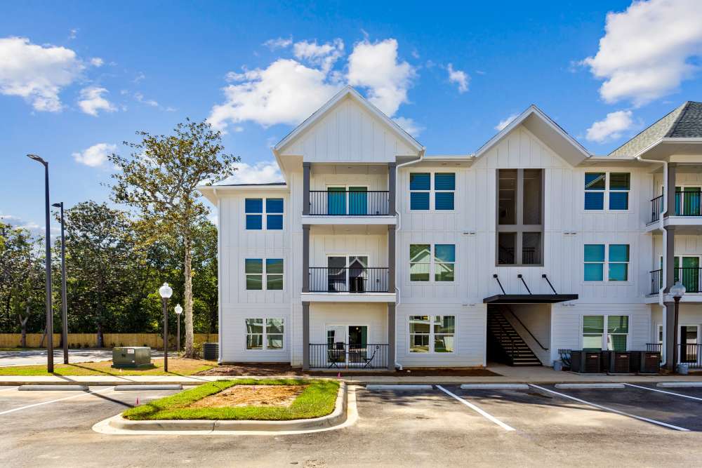  Two-Bedroom Apartments in Pensacola, FL - City North - Outside view of building, parking lot, and Sidewalk Access