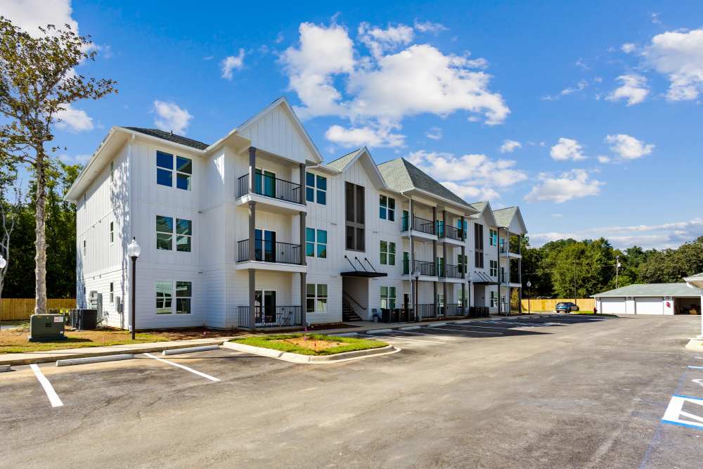  Two-Bedroom Apartments in Pensacola, FL - City North - Outside view of building, parking lot, and Sidewalk Access