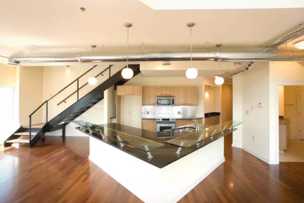  Model unit kitchen area with glass countertop at 17th Street Lofts in Atlanta, Georgia