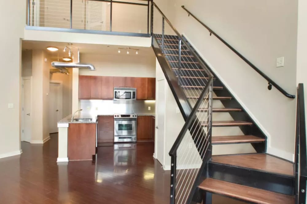 Model unit with wooden floor design at 17th Street Lofts in Atlanta, Georgia