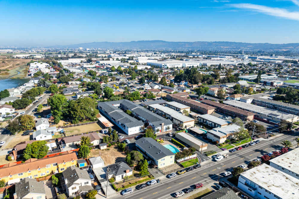 Two-Bedroom Apartments in San Leandro, CA - Marina Plaza Apartments -  Apartment Complex  aeriel View, and Sidewalk Access with lush courtyards
