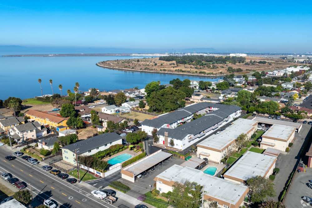 Two-Bedroom Apartments in San Leandro, CA - Marina Plaza Apartments -  Apartment Complex  aeriel View, and Sidewalk Access with lush courtyards