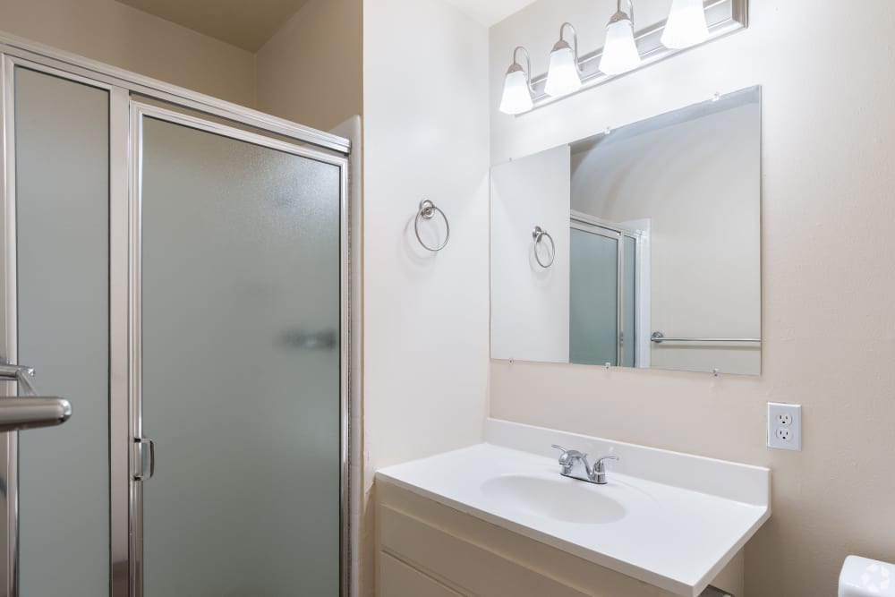 Pet-Friendly Apartments in San Leandro, CA - Marina Plaza Apartments- Bathroom with large counter space and vanity