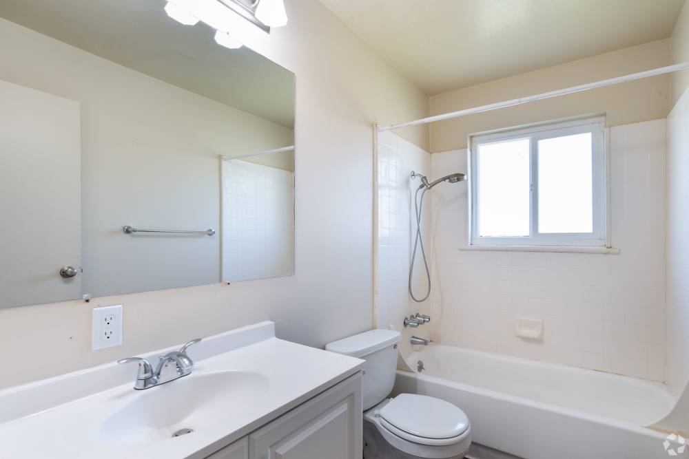 Pet-Friendly Apartments in San Leandro, CA - Marina Plaza Apartments- Bathroom with large counter space and vanity