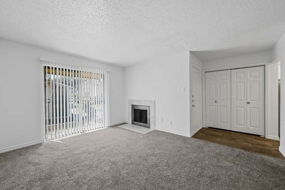 Living room with carpeting at Broadmoor Place in Irving, Texas