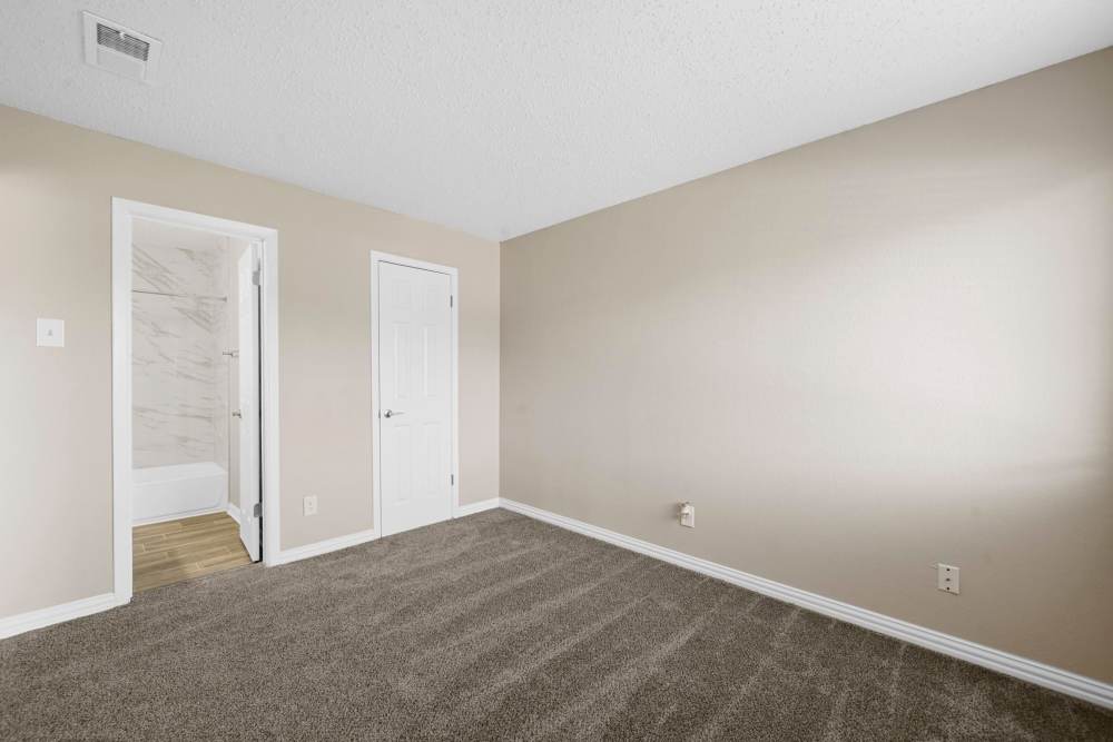 Spacious, empty bedroom at Village Square in Irving. TX