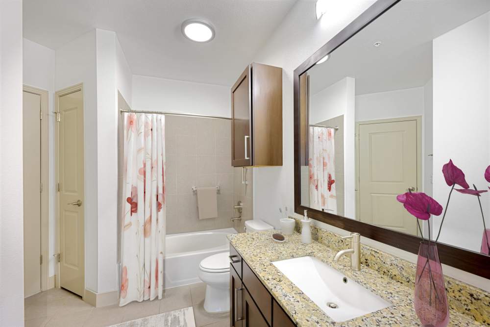 Spacious Bathroom with Brown Cabinets at Helios in Englewood, Colorado