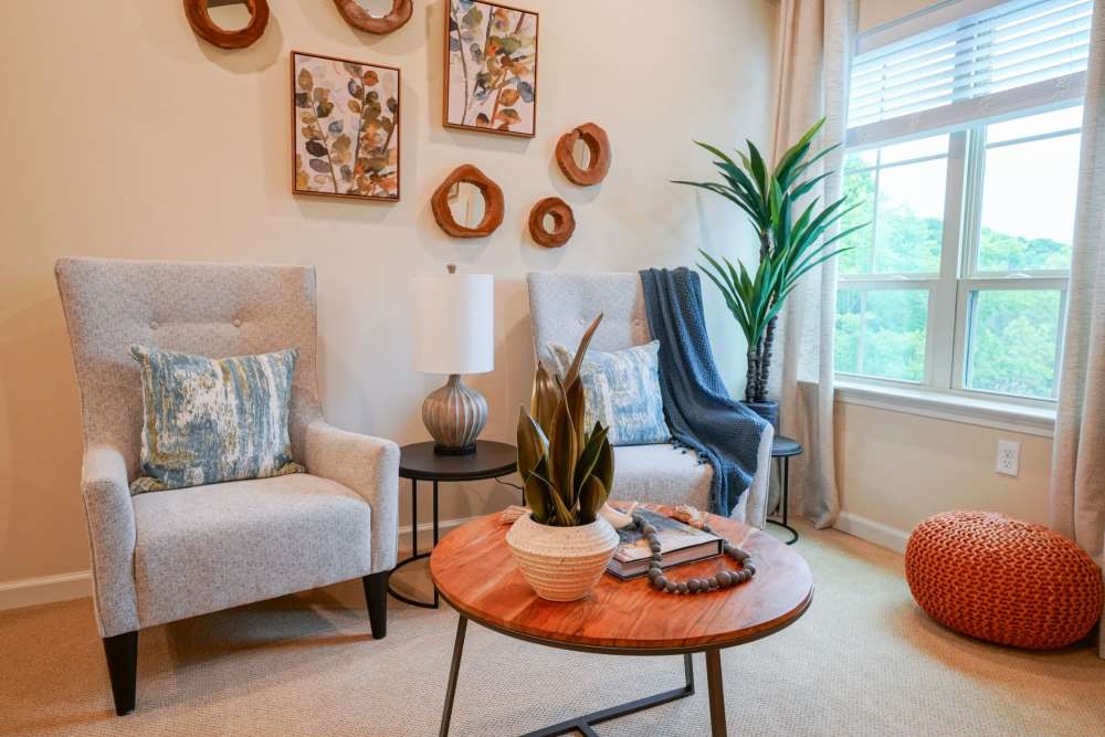 Comfortable living space with wood-style flooring at Harmony at Bellevue in Nashville, Tennessee