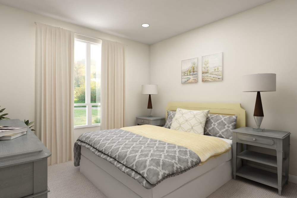 A bedroom with large comfortable bed and windows at Harmony at Tucker Station in Louisville, Kentucky