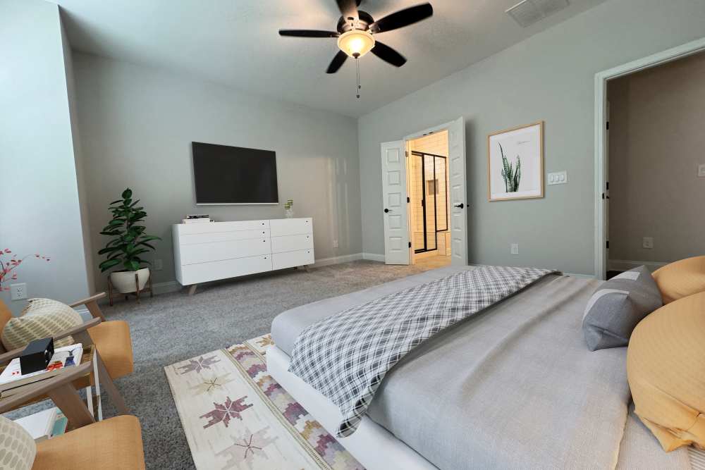 Master bedroom in a model home at Hayloft Big Creek in Alpharetta, Georgia