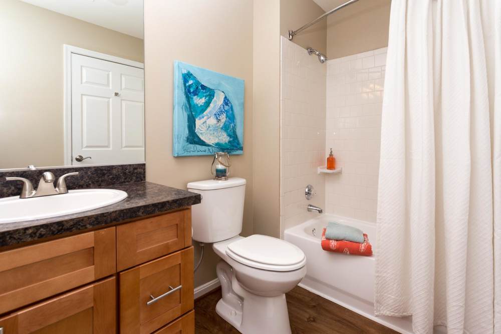 Bathroom with a toilet, tub and a wash basin at Beacon Place at Kentlands in Gaithersburg, Maryland