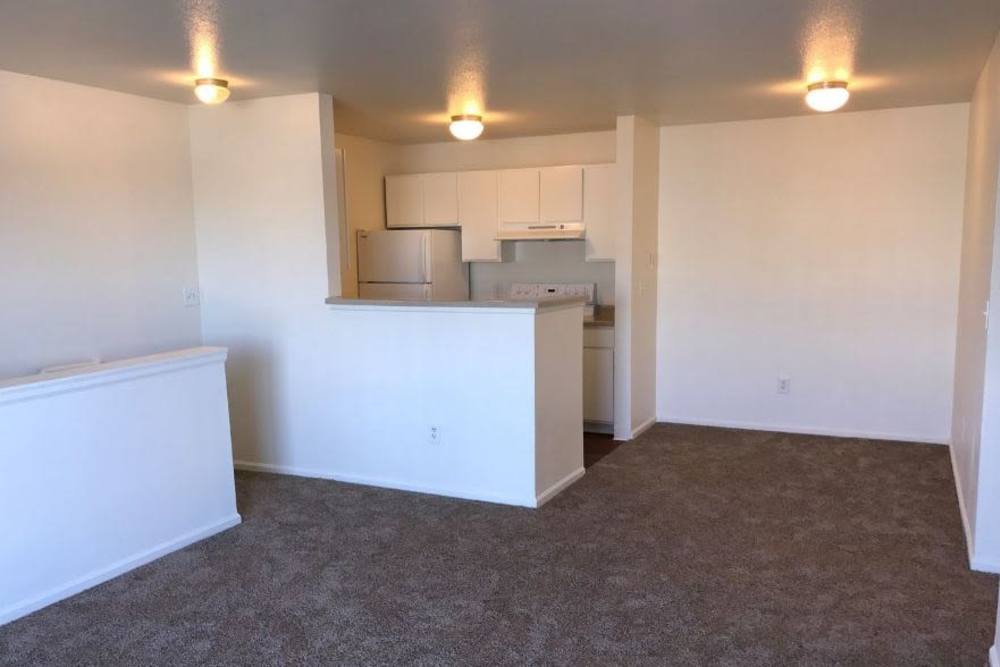 Home living room and kitchen at Columbine Apartments in Littleton, Colorado