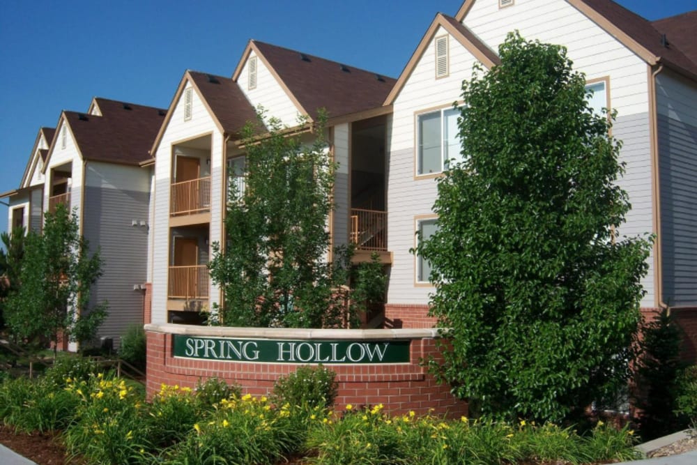 Community sign at Spring Hollow Apartments in Brighton, Colorado