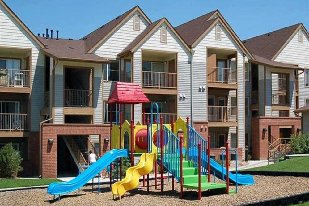 Playground between apartment buildings at Spring Hollow Apartments in Brighton, Colorado