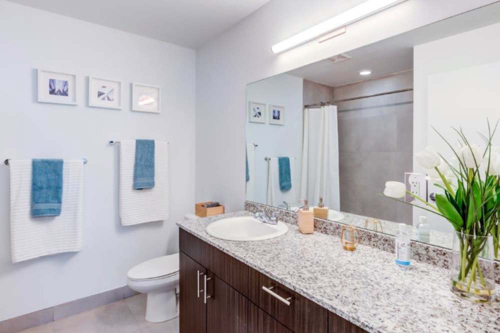Spacious bathroom with granite counters at Sophia Square in Homestead, Florida