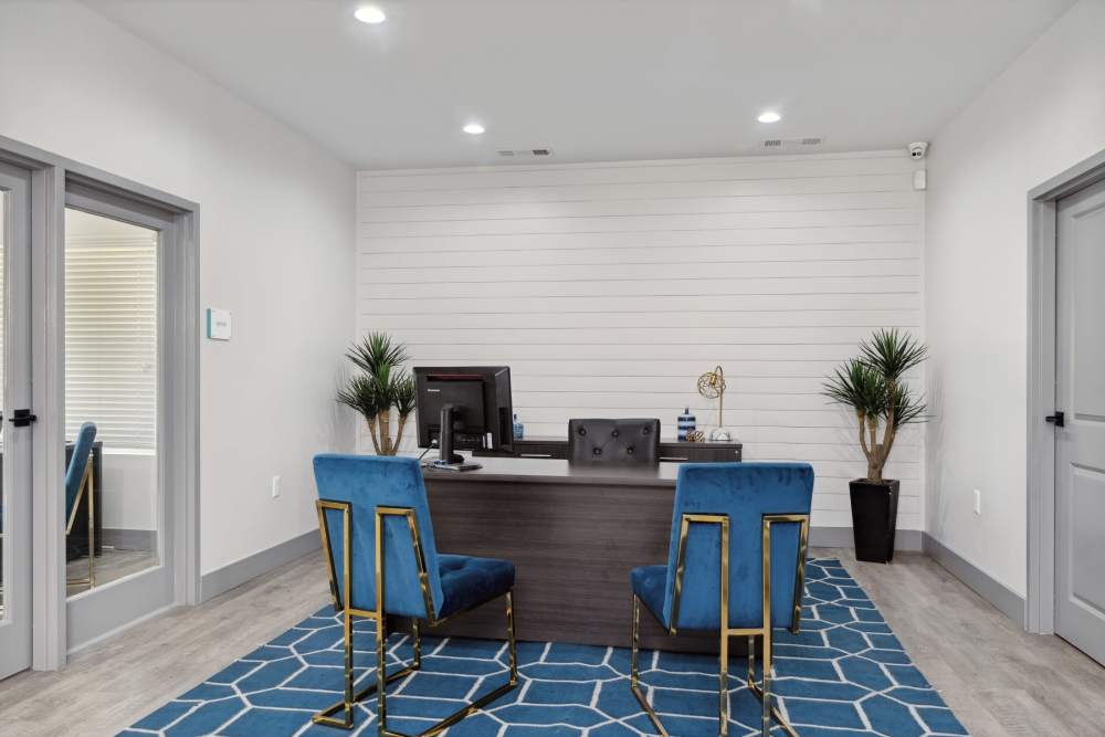Community workspace with blue area rug at Retreat at RTP in Durham, North Carolina
