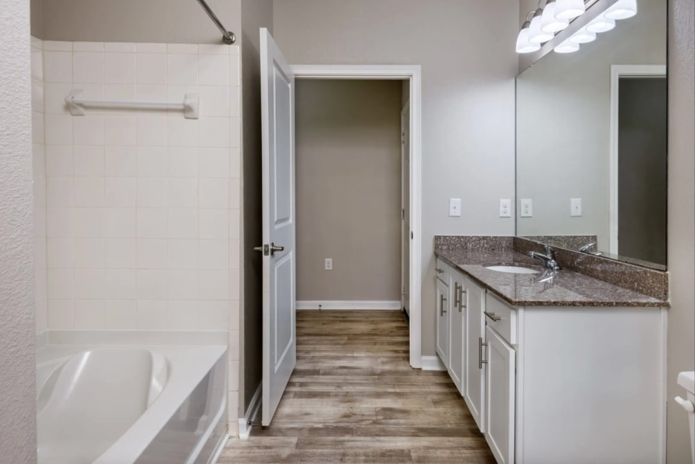 Bathroom with large bathroom vanity mirror at Retreat at RTP in Durham, North Carolina