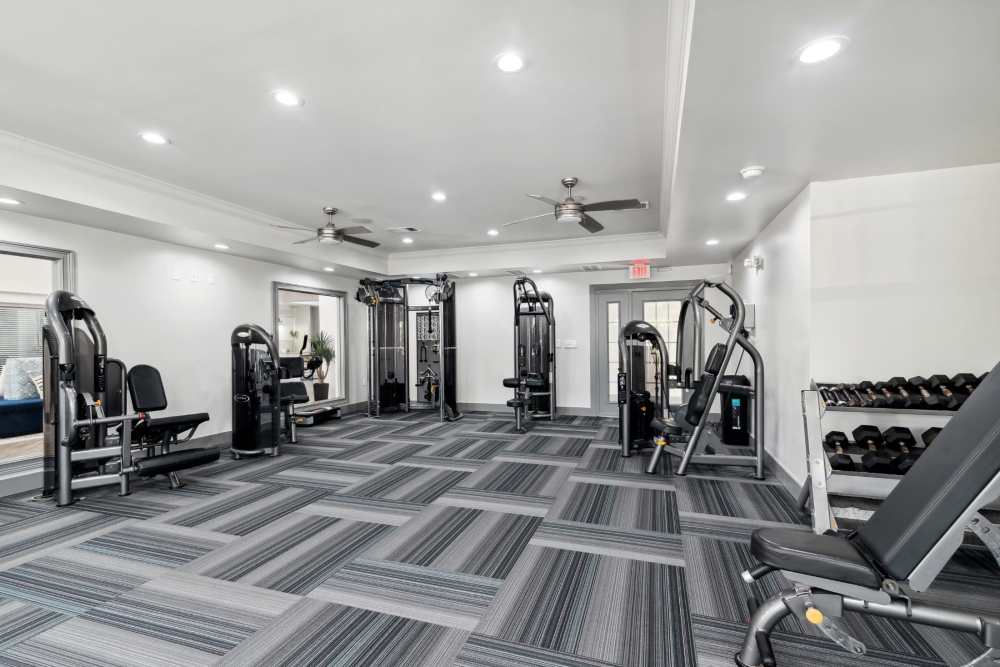 Spacious fitness center with weight machines at Retreat at RTP in Durham, North Carolina
