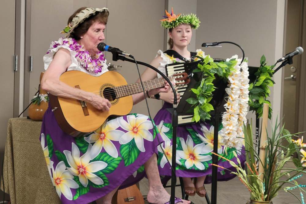 Entertainment at a luau party at Lighthouse Pointe by Barclay House in Chesapeake, Virginia
