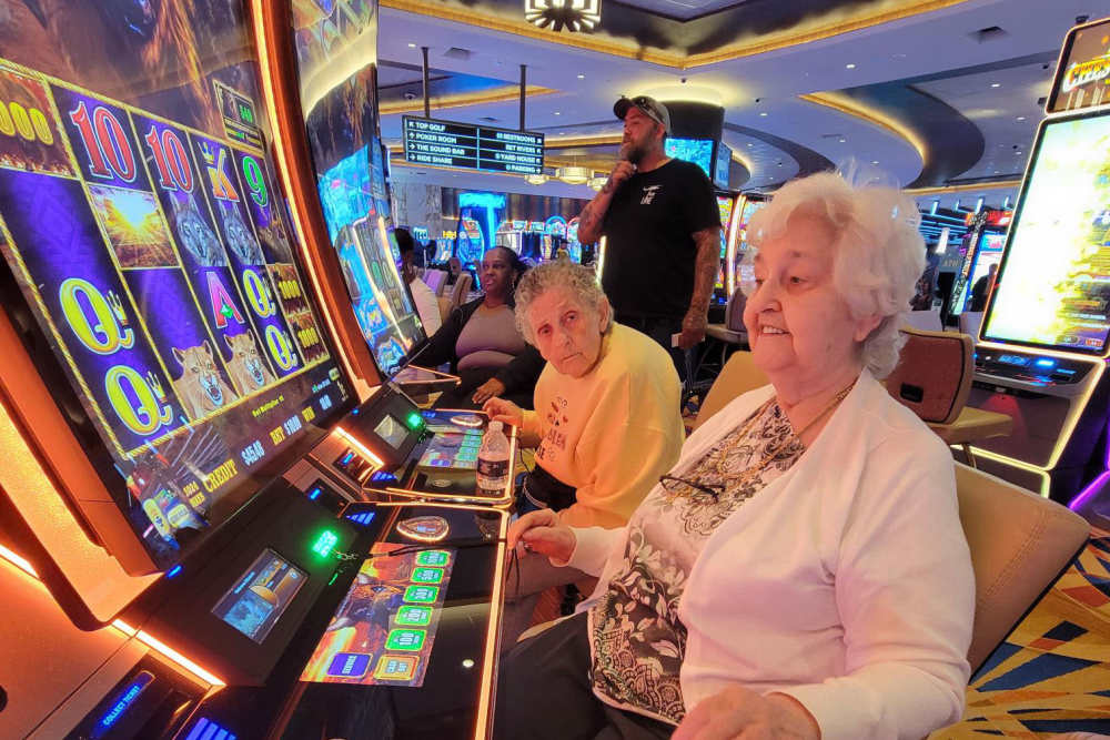 Residents playing casino-style games at Lighthouse Pointe by Barclay House in Chesapeake, Virginia