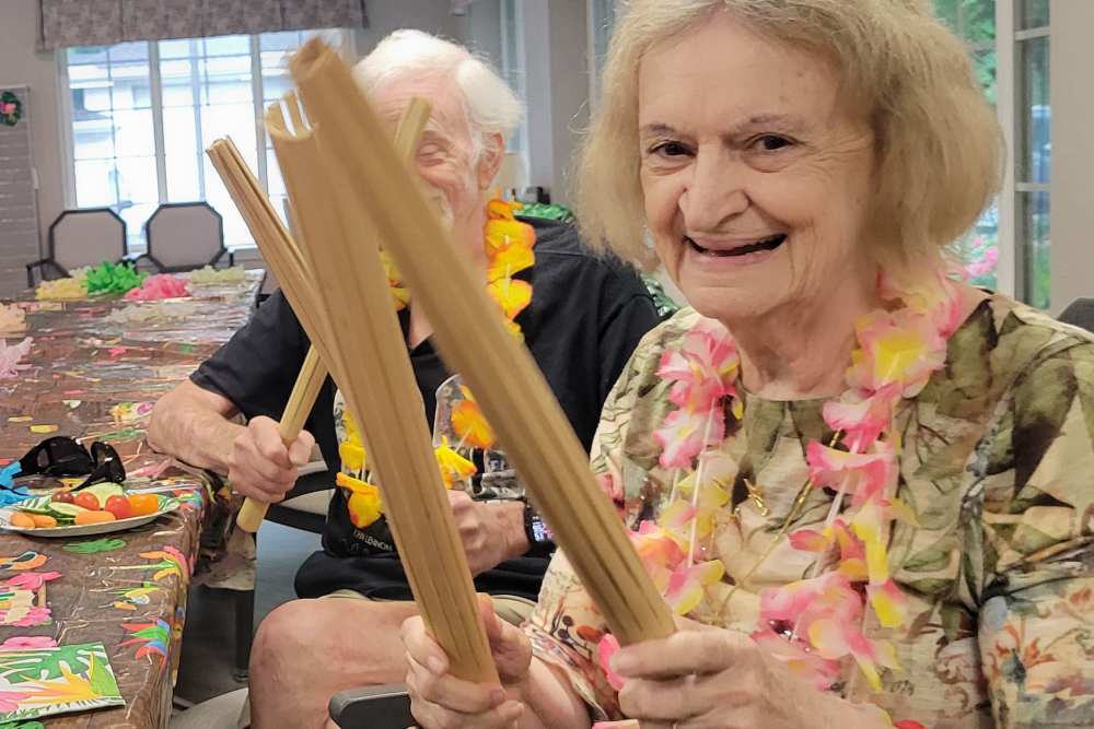 Residents having fun at a party at Lighthouse Pointe by Barclay House in Chesapeake, Virginia