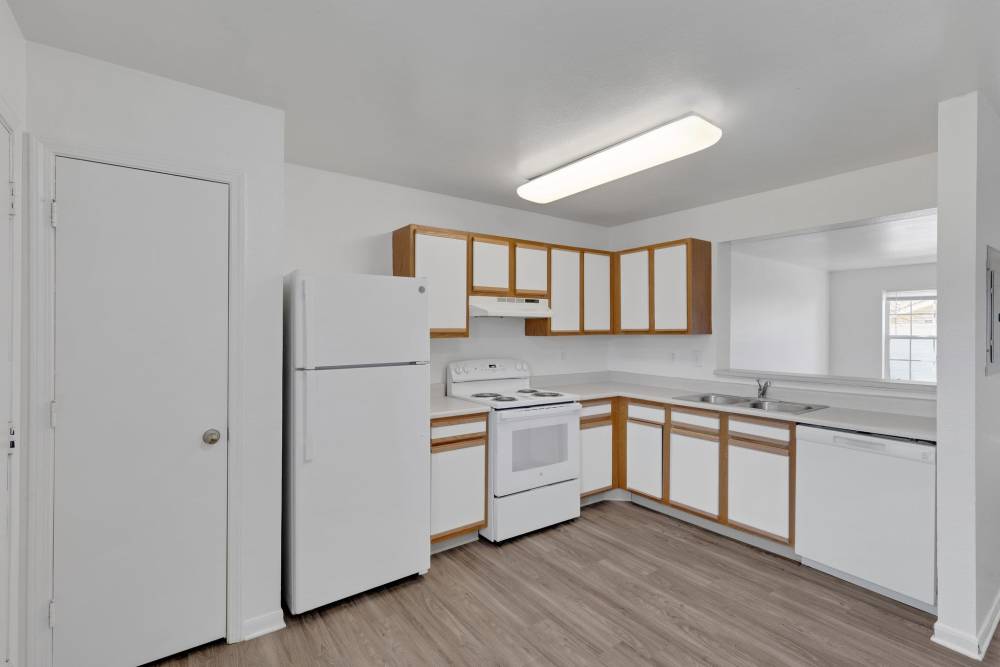 Modern kitchen with refrigerator and dishwasher at Timber Lake in Avon, Ohio