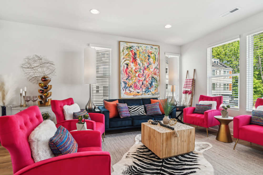 Living room with ample sunlight at Crossings At NoDa in Charlotte, North Carolina