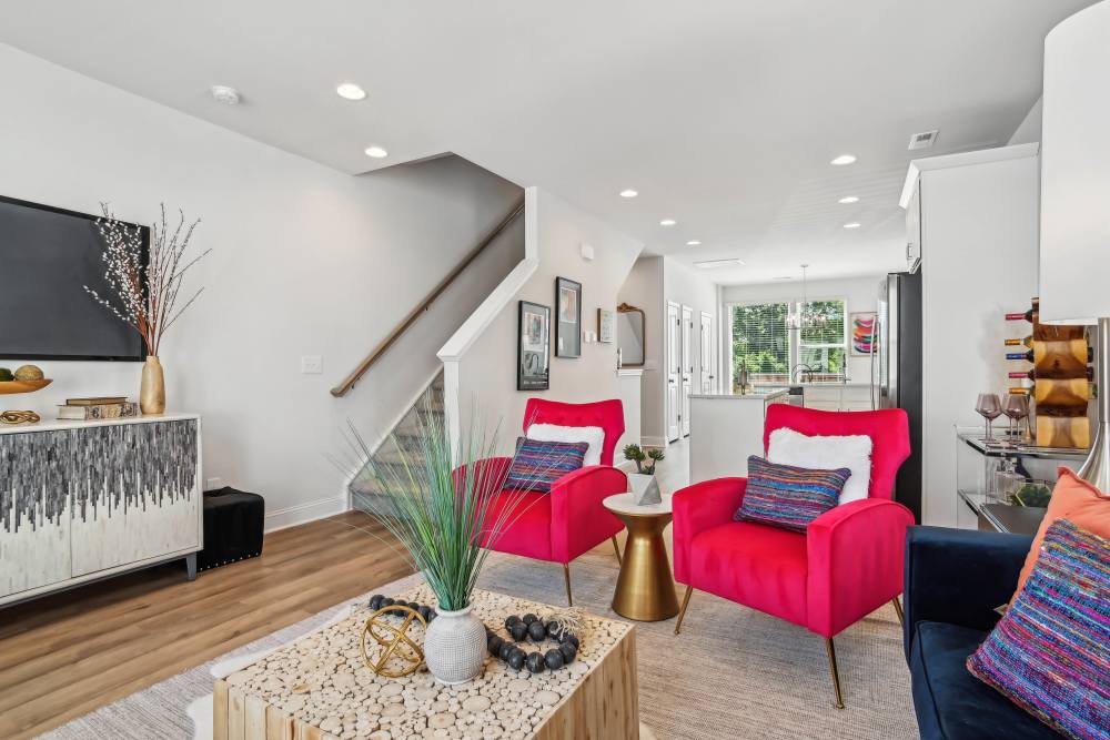 Living room with red sofa at Crossings At NoDa in Charlotte, North Carolina